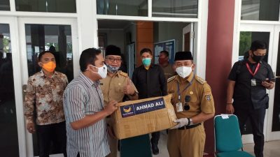 Abdul Rahim Salurkan Ribuan Masker Di Polman Bantuan Dari DPP Partai Nasdem