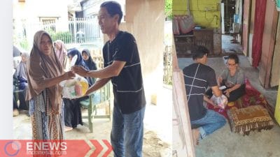 Anggota HIP INTIS Aceh saat membagikan bantuan kepada korban yang terdampak bencana.